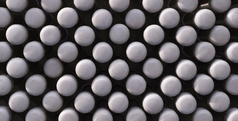 abstract texture of rods with white circle heads texture. design, background.