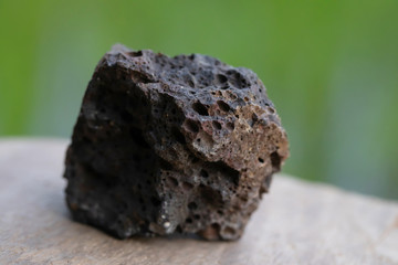 minerals of Basalt rock for industry isolate on green background