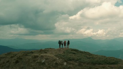 The flight near four hikers on a mountain