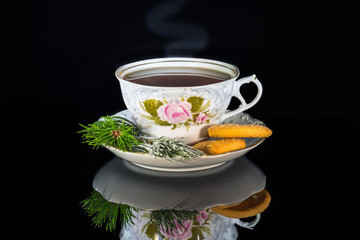 Cup of tea on a plate with cookies