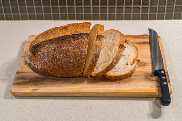 Bread and knife on a kitchen table