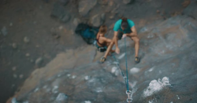 Rock climber falling on a rock wall in slow motion