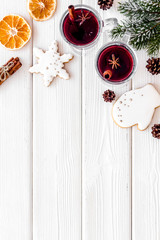 Background with mulled wine and New Year decoration on white wooden background top view frame copy space
