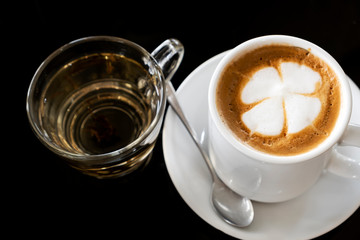 Hot coffee and tea on a black background