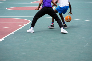 Two young boys playing a one on one match