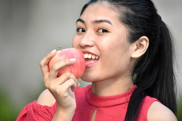 Beautiful Asian Girl Eating With Fruit