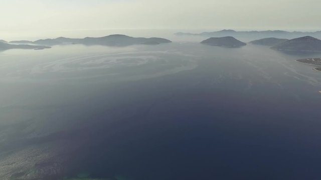 Flight over desert islands and colorful sea, Brijuni park, Croatia