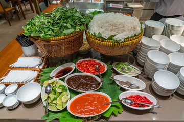 Traditional Vietnamese Pho noodle soup counter in Asian restaurant