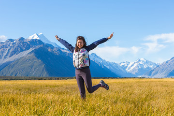 Summertime , Asian woman enjoy travel at mount cook national park in south Island New Zealand, Concept of woman solo travel and relaxation moment