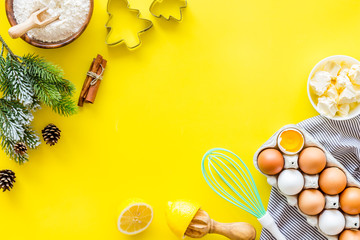 Cooking for Christmas or New Year dinner. . Dough ingredients on yellow background top view space for text