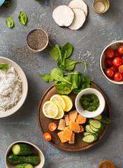 Ingredients for preparation poke bowl with salmon, avocado, vegetables and chia seeds top view