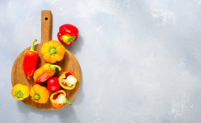 Fresh homemade peppers on light background top view. Flat lay, copy space