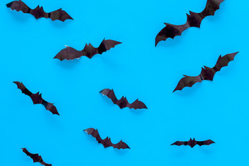 Halloween background with bats on blue table top view