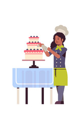 female professional chef pastry cook decorating tasty wedding cream cake african american woman restaurant worker in uniform cooking food concept flat full length vertical