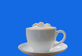 Abstract a cup of latte coffee with the isolated blue background.