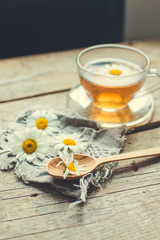 cup of herbal tea with chamomile flowers