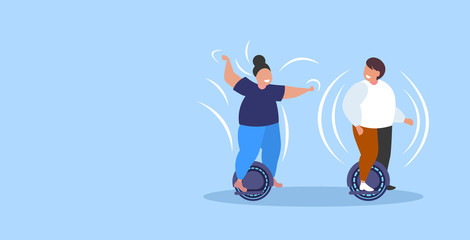 fat obese man woman riding self balancing scooter couple standing on electric gyroscooter personal electrical transport obesity concept people having fun horizontal full length