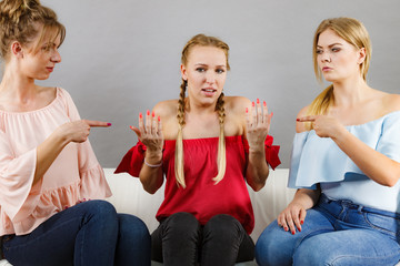 Woman being bullied by two females