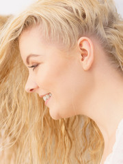 Portrait of happy blonde woman