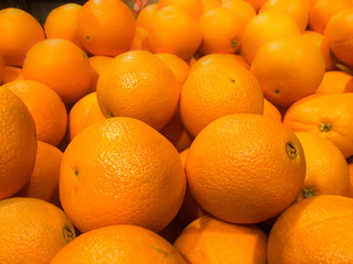 Large oranges in the warehouse of a supermarket.