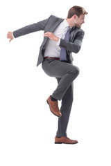 in full growth. young businessman taking a step to success