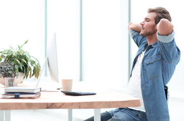 young businessman, looking carefully at the screen of his computer