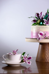 A beautiful holiday cake decorated with fresh flowers.