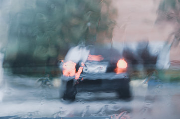 View through car windshield during the heavy rain