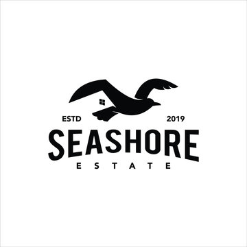 simple classic black retro real estate company logo with seagull bird 