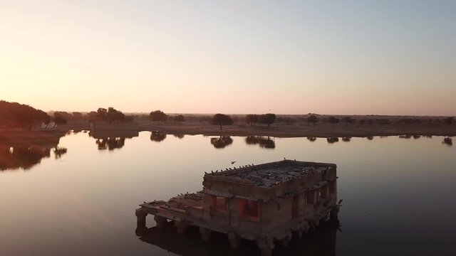 Aerial view 4k video by drone of Shrines And Temples At Gad sisar Lake, Jaisalmer, India - Rajasthan.