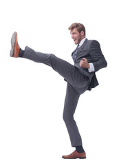 in full growth. smiling businessman pushing off the wall