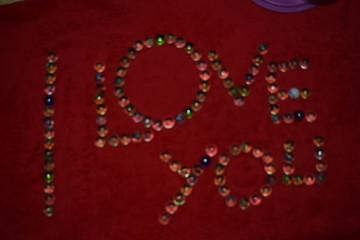 character letters from marbles with a red bakground