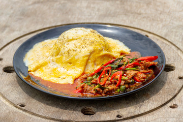 Creamy Omelet with hot and spicy beef panang curry on jusmine Rice