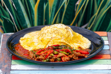 Creamy Omelet with hot and spicy beef panang curry on jusmine Rice