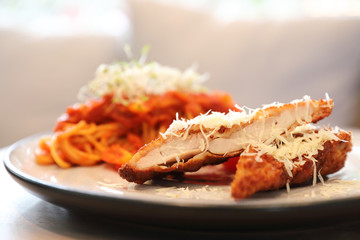 Spaghetti bolognese tomato sauce with fried chicken ,