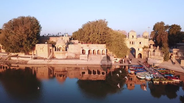 Aerial view 4k video by drone of Shrines And Temples At Gad sisar Lake, Jaisalmer, India - Rajasthan.