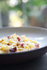 fettuccine carbonara , fettuccine pasta spaghetti with bacon ham and mushroon in white sauce italian food