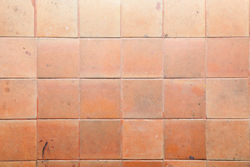 Old orange brick wall, texture of orange stone blocks closeup. Wall texture. Background of old vintage brick wall.