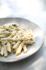 Penne pasta with white sauce and truffle , italian food