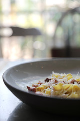 fettuccine carbonara , fettuccine pasta spaghetti with bacon ham and mushroon in white sauce italian food