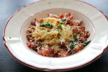 Spaghetti white sauce (Spaghetti Carbonara) with bacon and garlic , on wood table background