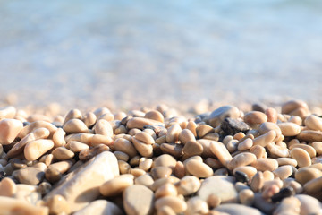 Closeup view of pebble beach on sunny day