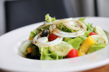 Caesar Salad on wood background