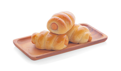 Fresh hot crusty bread rolls. Sausages in dough