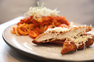 Spaghetti bolognese tomato sauce with fried chicken ,