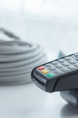 card payment terminal, on background the wires