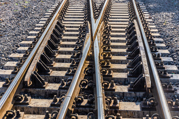 Fototapeta premium Close up of redirection train or railroad tracks with cement backing In the countryside Thailand