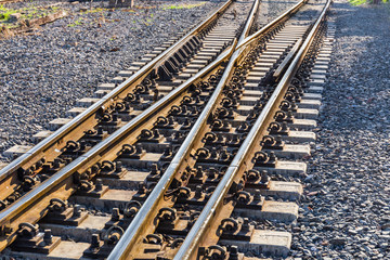 Fototapeta premium Close up of redirection train or railroad tracks with cement backing In the countryside Thailand