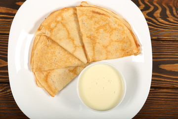 homemade thin pancakes are on the plate