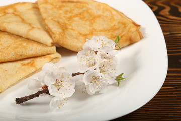 homemade thin pancakes are on the plate